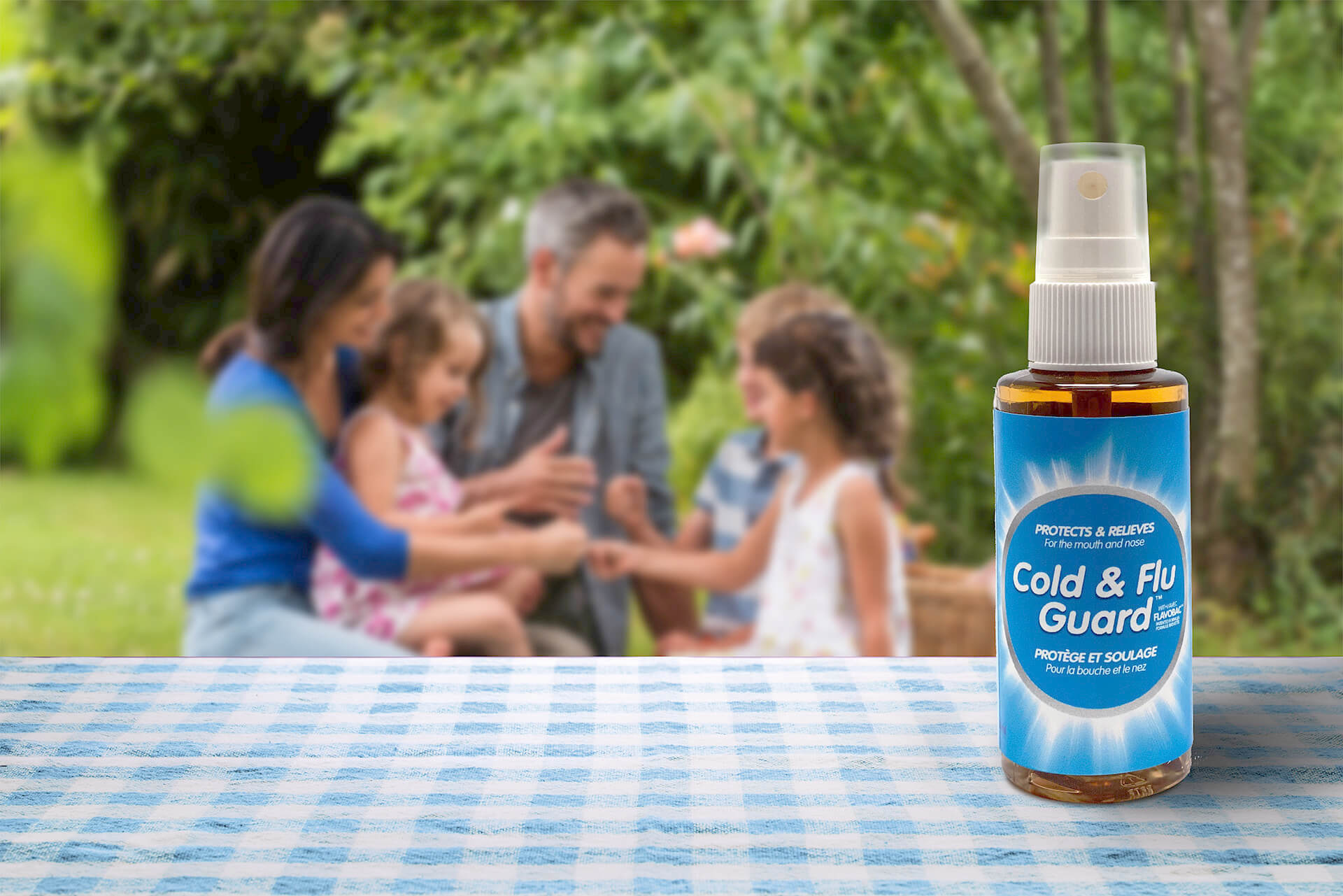 Familly with bottle of Cold & Flu Guard
